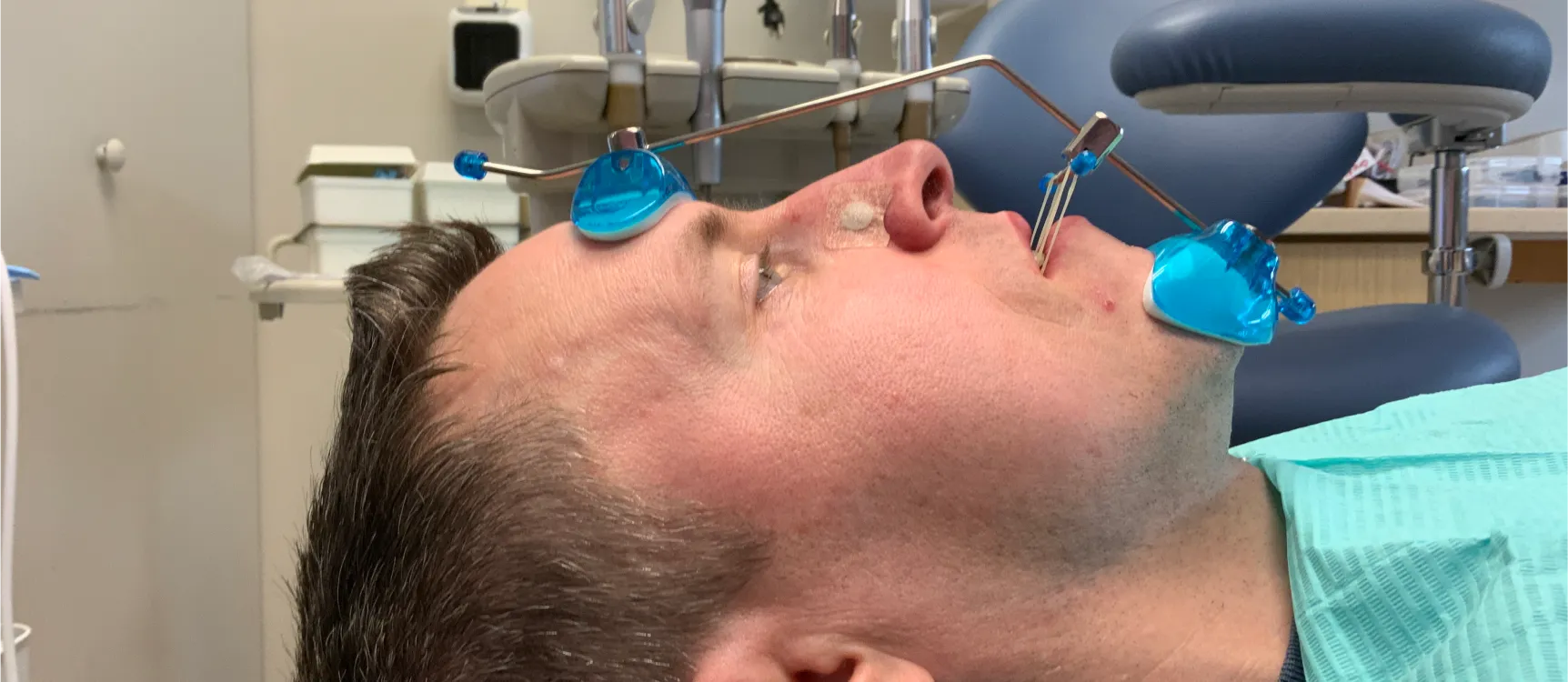 Patient laying on dentist chair